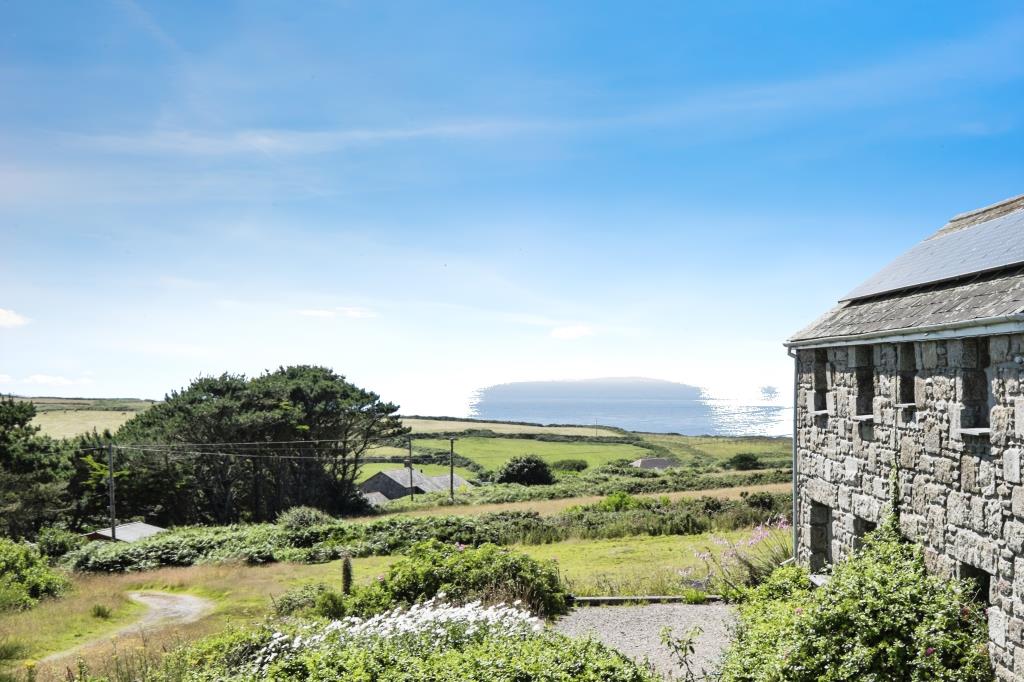 Lot: 72 - DETACHED BARN CONVERSION IN A LOVELY COUNTRYSIDE SETTING - View of countrywide and sea - photograph provided by seller
